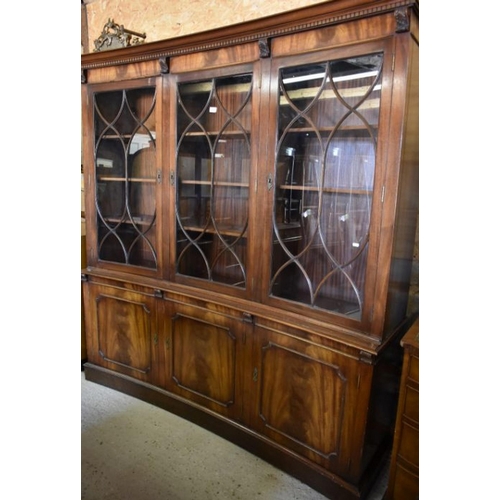 233 - A Victorian style mahogany astragal glazed library bookcase of concave form on a plinth base, 178 cm... 