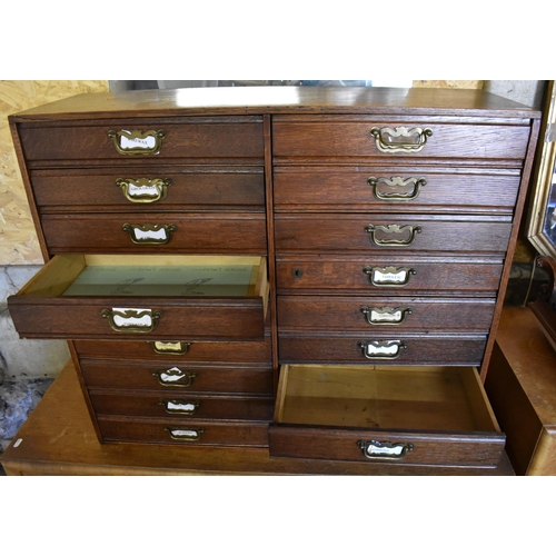 239 - An early 20th century oak sewing/collector's chest with eighteen drawers and brass handles, 78 cm wi... 