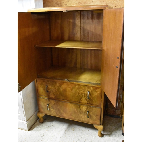 241 - A vintage walnut cabinet with cupboard doors over two drawers on cabriole supports, 75 cm wide x 42 ... 