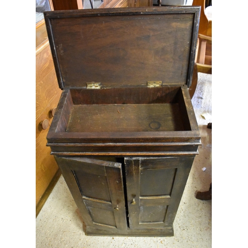 242 - A small antique oak side cabinet with panelled doors enclosing shelves, 48 cm wide x 26 cm deep x 83... 