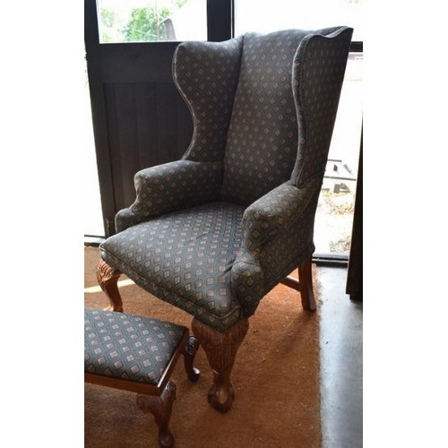 256 - A bespoke Georgian style wing-back armchair with acanthus carved cabriole legs and ball and claw fee... 