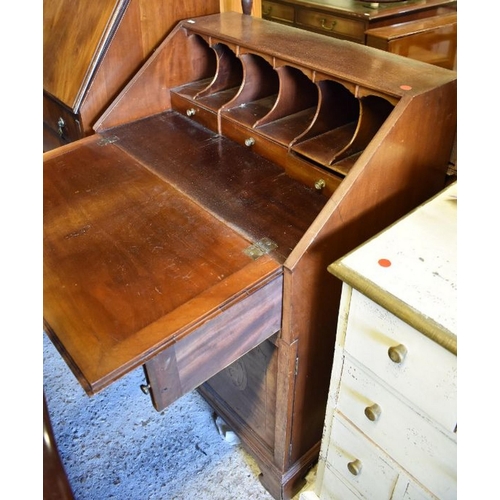 264 - A shell inlaid mahogany fitted bureau over a single drawer and pair of cabinet doors, on shaped brac... 