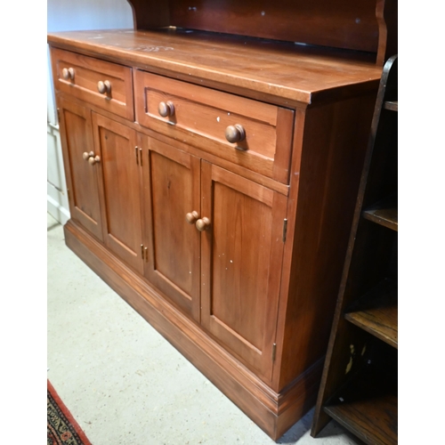 268 - A stained pine dresser with glazed doors enclosing three shelves on base with two drawers and panell... 