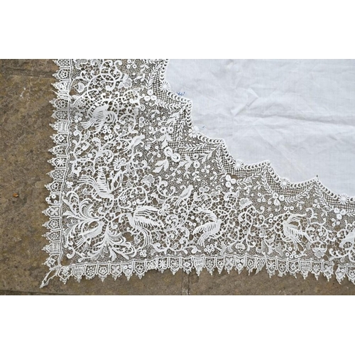 380 - A fine linen table cloth with broad lace border, 140 cm square