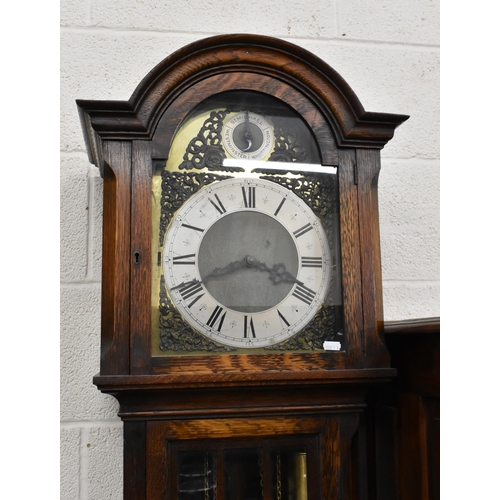 397 - A modern oak longcase clock with brass dial and triple chime movement, part glazed case c/w two weig... 