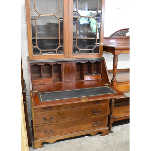 402 - Edwardian bureau bookcase with astragal glazed doors over fall front panel enclosing fitted interior... 