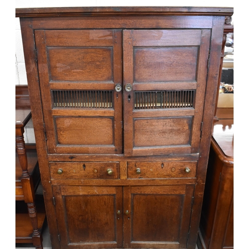 404 - An 18th century Welsh oak pantry cupboard with panelled doors and two drawers, 115 cm w x 50 cm d x ... 