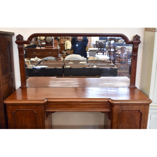 406 - A large Victorian mirror-backed mahogany sideboard with central drawer flanked by panelled cupboard ... 