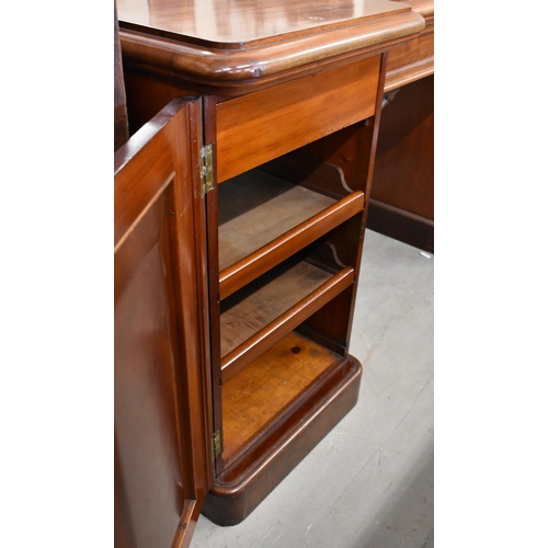 406 - A large Victorian mirror-backed mahogany sideboard with central drawer flanked by panelled cupboard ... 