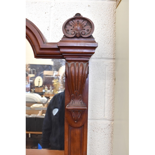 406 - A large Victorian mirror-backed mahogany sideboard with central drawer flanked by panelled cupboard ... 