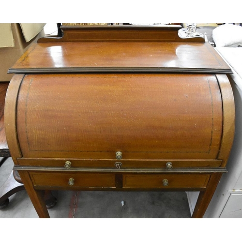 418 - A 19th century mahogany inlaid cylinder top desk with fitted interior and two drawers raised on tape... 