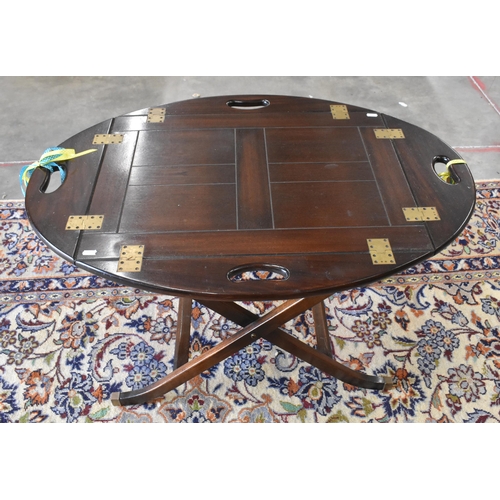 425 - A 'Harrods' retailed reproduction mahogany tray-top butlers table on folding stand