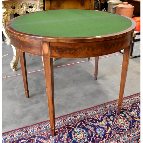 434 - A 19th century mahogany inlaid demi lune card table with folding base and lined top on tapering squa... 