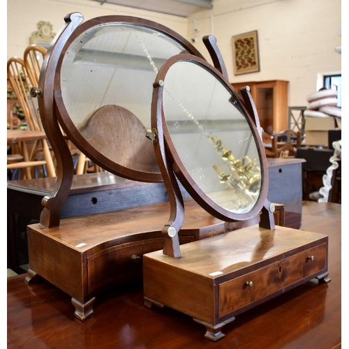 436 - A 19th century mahogany toilet mirror with bevelled oval plate and two drawer platform base with flo... 