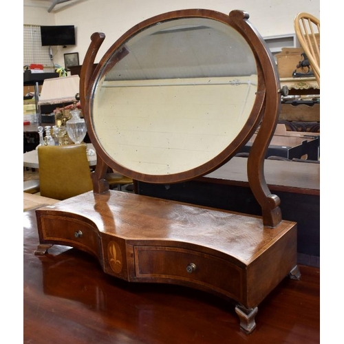 436 - A 19th century mahogany toilet mirror with bevelled oval plate and two drawer platform base with flo... 