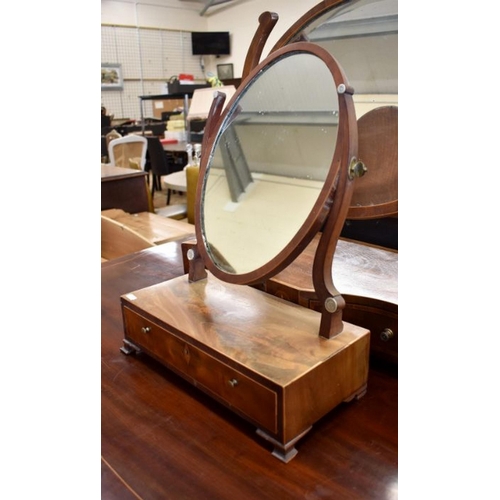 436 - A 19th century mahogany toilet mirror with bevelled oval plate and two drawer platform base with flo... 