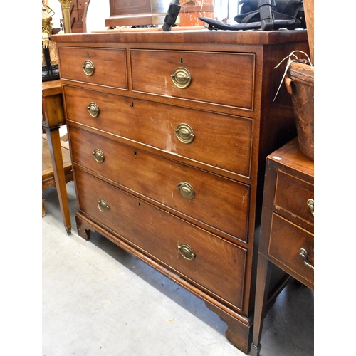 437 - A 19th century mahogany chest of two short over three long drawers with brass handles, raised on bra... 