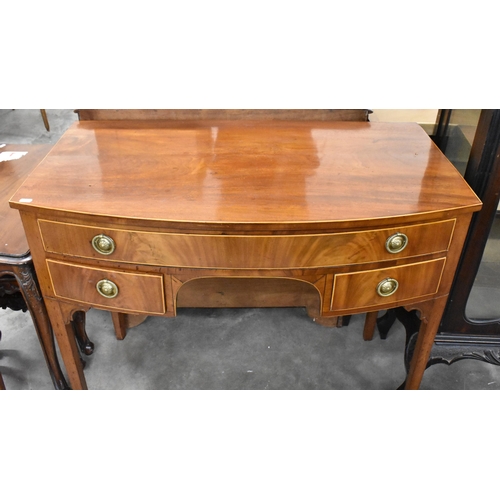 438 - A George III mahogany bowfront dressing table with three drawers 90 cm w x 50 cm d x 78 cm h