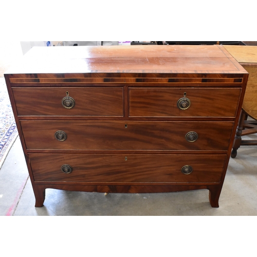 441 - A George III mahogany chest of two short over two long drawers with brass ring handles, raised on sp... 