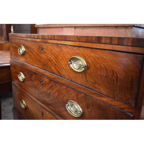 445 - A 19th century mahogany chest of four long graduated drawers with floral embossed brass handles, sta... 