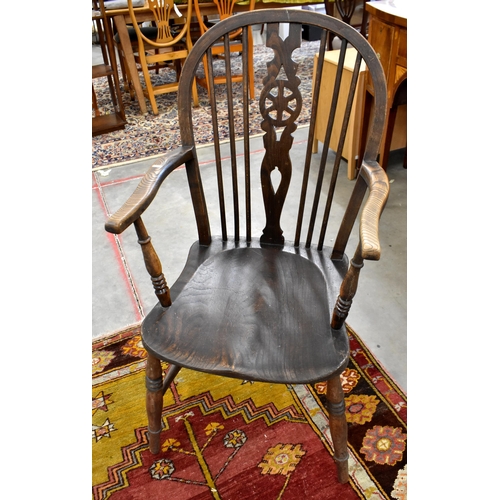 448 - A 19th century mahogany circular backed hall chair, provincial elm wheelback carver chair and oak si... 