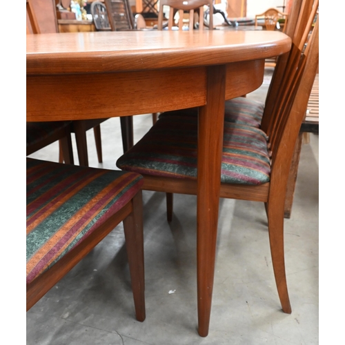 453 - A mid century G-Plan Fresco teak extending dining table, the sliding top opening to allow the storab... 