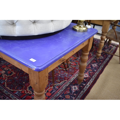 459 - A rectangular pine kitchen dining table with blue painted top and turned legs, 150 cm x 90 cm x 76 c... 