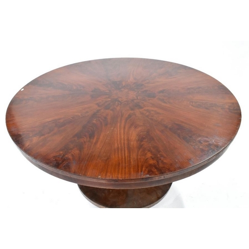 469 - A Victorian rosewood breakfast table, the circular tilt top with radiating veneers, raised on a mult... 