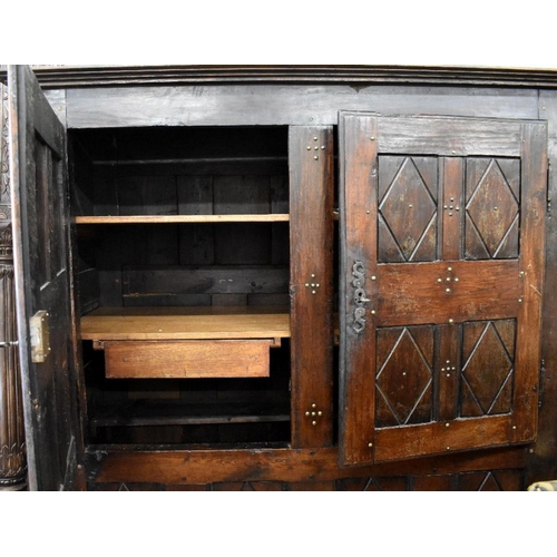 470 - A large antique French cupboard with brass studded panelled doors, 175 cm wide x 74 cm deep x 184 cm... 