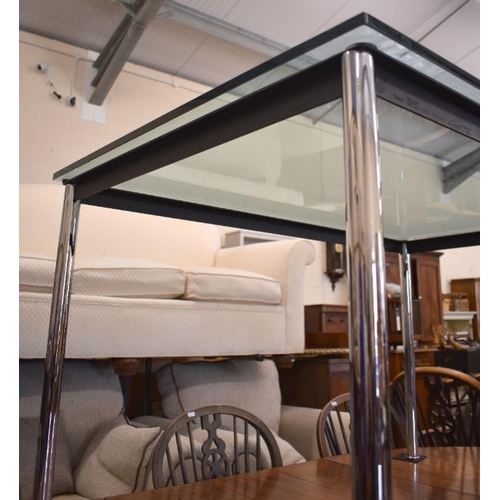 486 - A contemporary Italian Cassina 'Le Courbusier' dining table with tinted glass top and tubular chrome... 