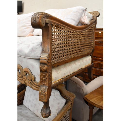 487 - Early 20th century carved oak double caned bergere suite comprising three-seater sofa, 190 cm w x 90... 