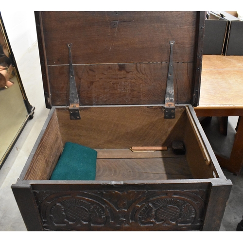 490 - A 17th century and later oak bible box with hinged top and thistle carved front panel on turned supp... 