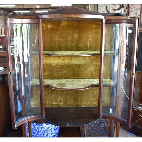 495 - An Edwardian walnut bow fronted display cabinet on square legs to spade feet, 91 cm x 37 cm x 166 cm... 