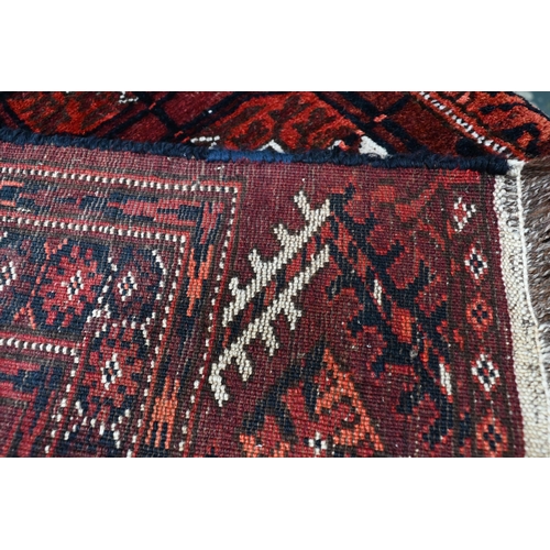 502 - An old Turkman Tekke rug, the red-brown ground with geometric guls, 218 x 120 cm