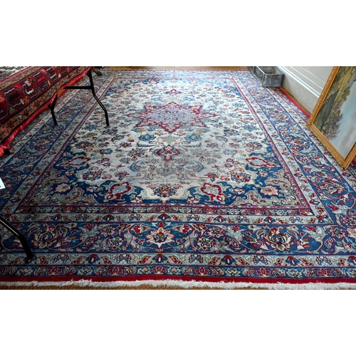 504 - Antique Persian hand-made Isfahan carpet, the ivory field centred by a floral medallion and flowery ... 