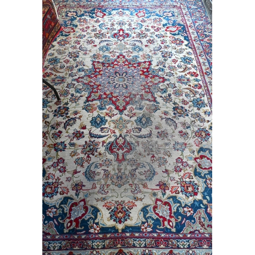 504 - Antique Persian hand-made Isfahan carpet, the ivory field centred by a floral medallion and flowery ... 