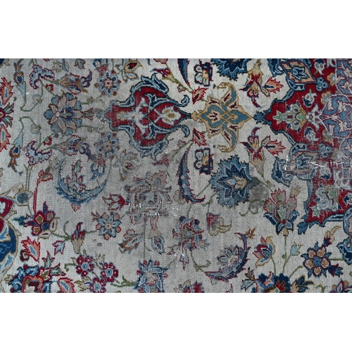 504 - Antique Persian hand-made Isfahan carpet, the ivory field centred by a floral medallion and flowery ... 