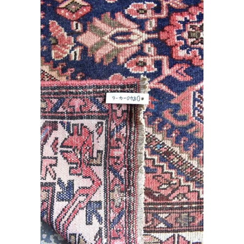 506 - A Malayer carpet, the stylised floral design on dark blue ground, 290 x 150 cm