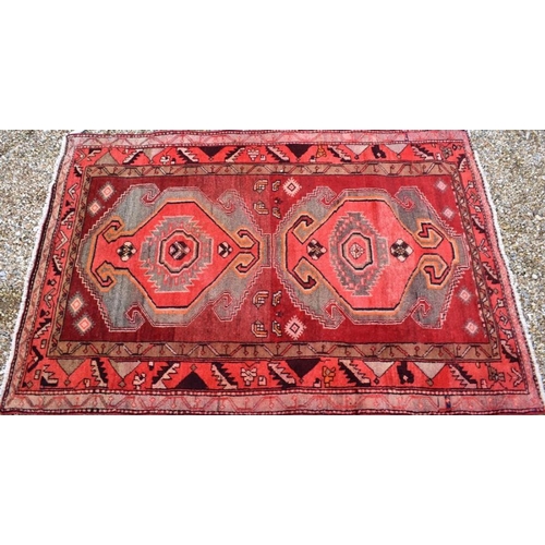 508 - A contemporary Persian Tafresh rug, the twin lozenge design on red ground, 190 x 130 cm