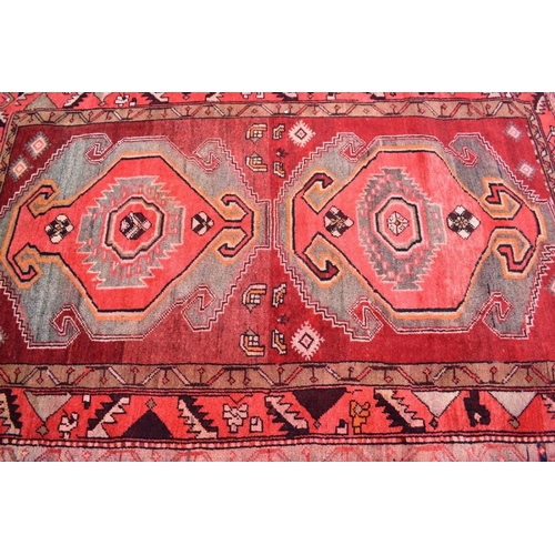 508 - A contemporary Persian Tafresh rug, the twin lozenge design on red ground, 190 x 130 cm