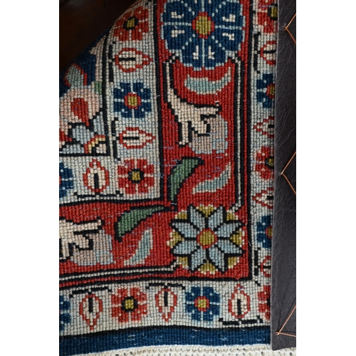 510 - Persian Veremin rug with floral design on a blue ground, 150 x 106 cm