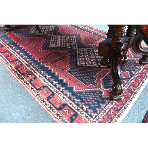 514 - Old Persian Afshar rug with triple lozenge design on a red and blue ground, 193 x 145 cm