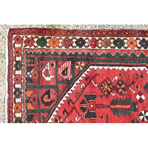 516 - A contemporary Persian Hamadan rug, the red ground with geometric design, 220 x 165 cm