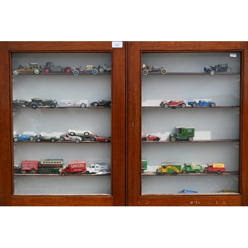 535 - Approximately seventy Lesney Models of Yestyear, with boxes and display cases