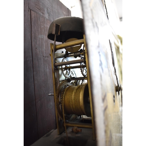 563 - An early 19th century mahogany longcase clock, the enamelled and painted dial topped by a rocking ta... 