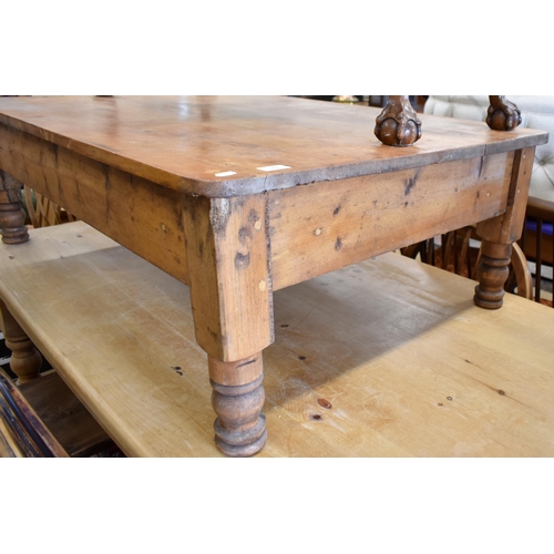 567 - A vintage stained pine low rectangular coffee table on turned supports, 120 cm x 80 cm x 40 cm h