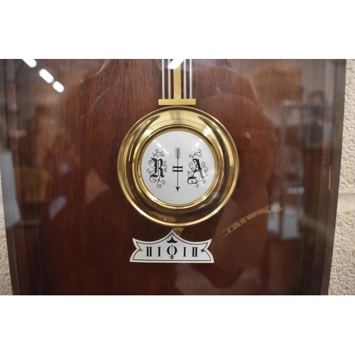 580 - A reproduction German Vienna style wall clock with glazed teak case, triple train movement striking ... 