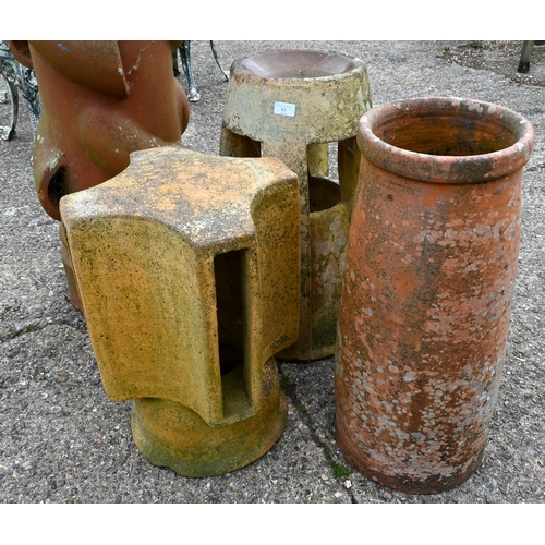 61 - An large old weathered 'Spiralvent' chimney pot to/with three other assorted old chimney pots and a ... 