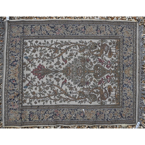 614 - A Turkish geometric design red ground rug, 120 cm x 71 cm, to/w a machine made Kashan style rug and ... 