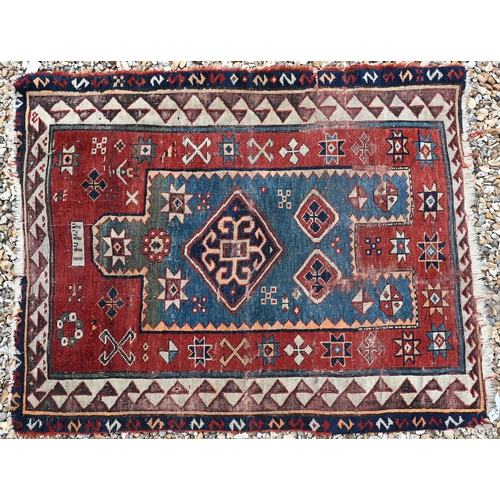 616 - Two old worn Caucasian red ground prayer rugs, 112 cm x 90 cm and 120 cm x 96 cm (2)